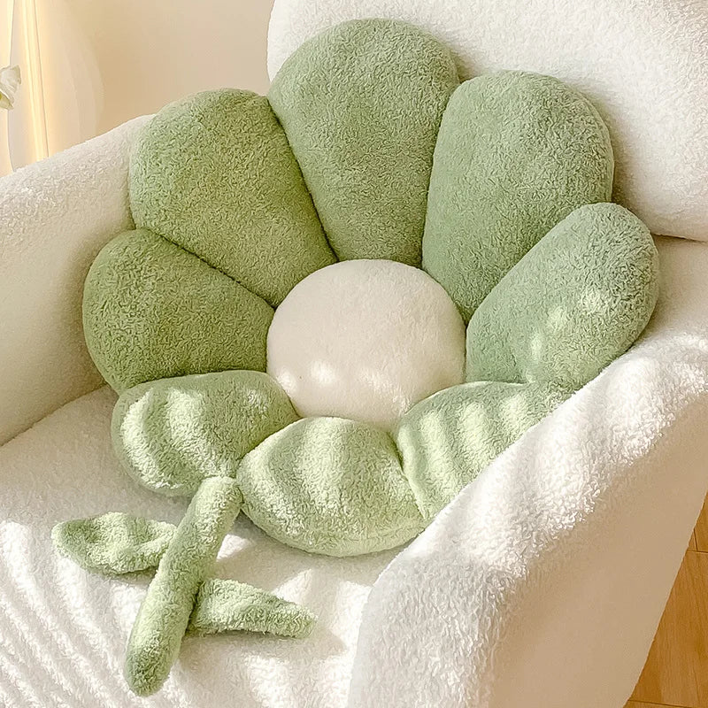 Green flower-shaped Kawaii cushion on a white surface