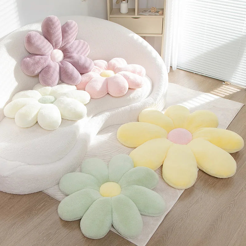 Kawaii flower-shaped cushions in pastel colors on a wooden floor.
