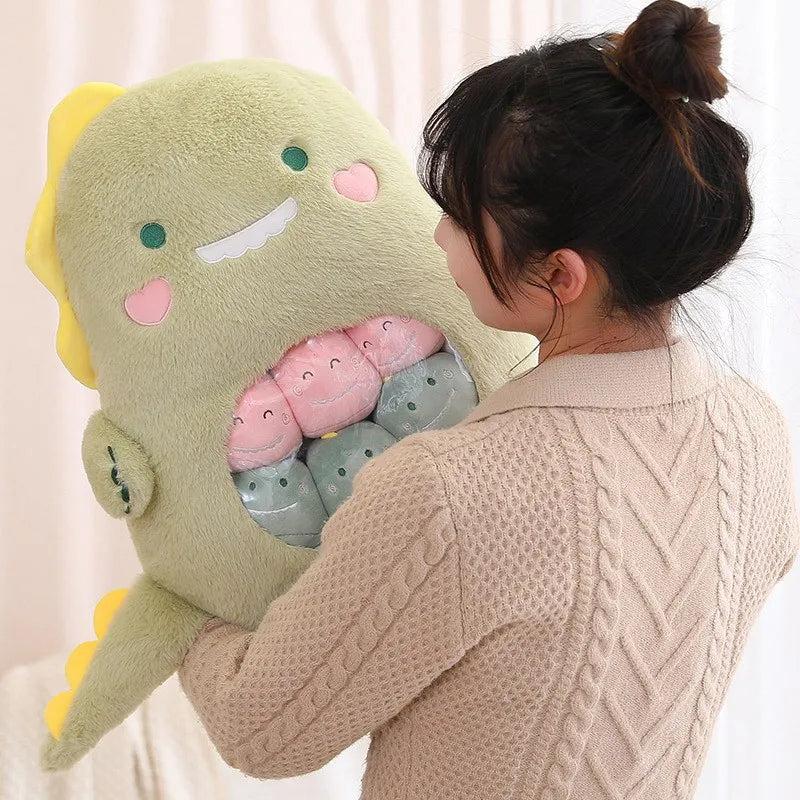 Person holding a large green dinosaur kawaii plush toy with pink and gray eggs.