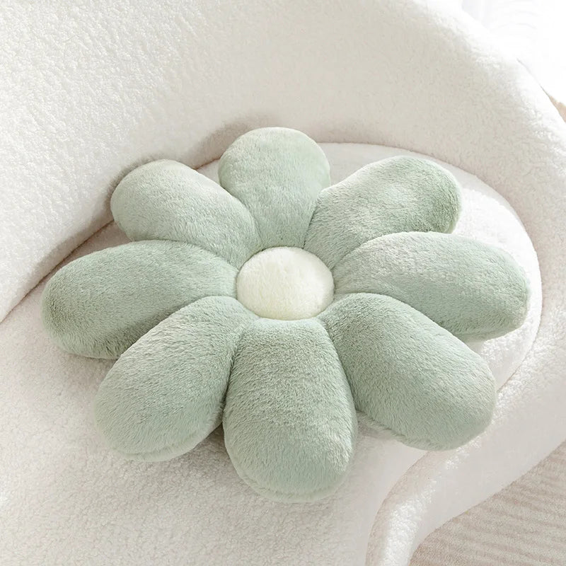 Kawaii flower-shaped cushion with a white center on a light background