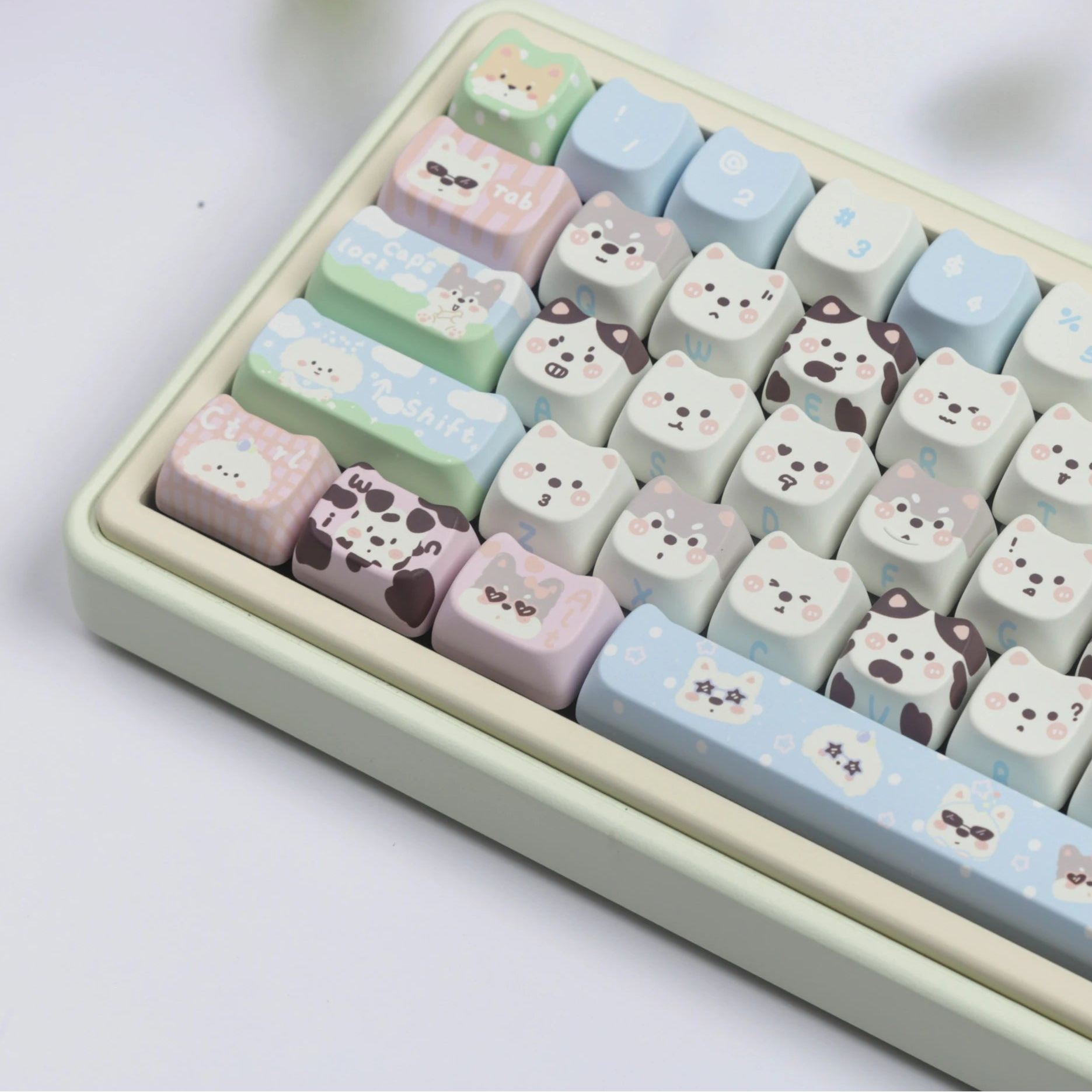 Keyboard with kawaii cute animal-themed keycaps on a light background