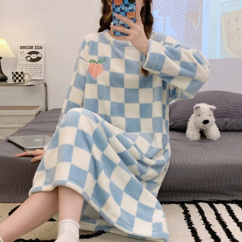 Person wearing a blue and white kawaii checkered robe sitting on a couch.
