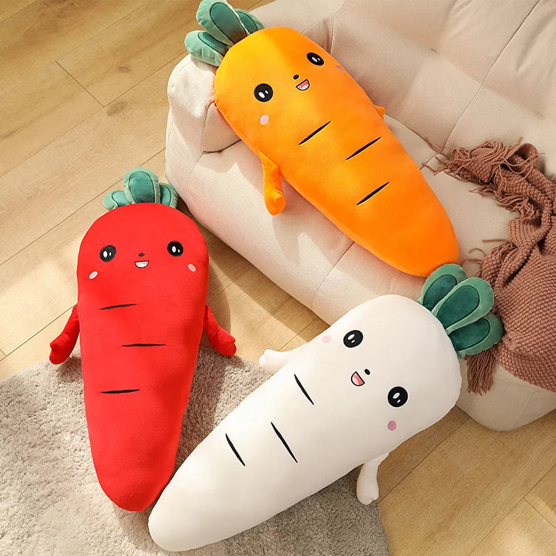 Three carrot-shaped kawaii plush toys in red, orange, and white on a wooden floor.