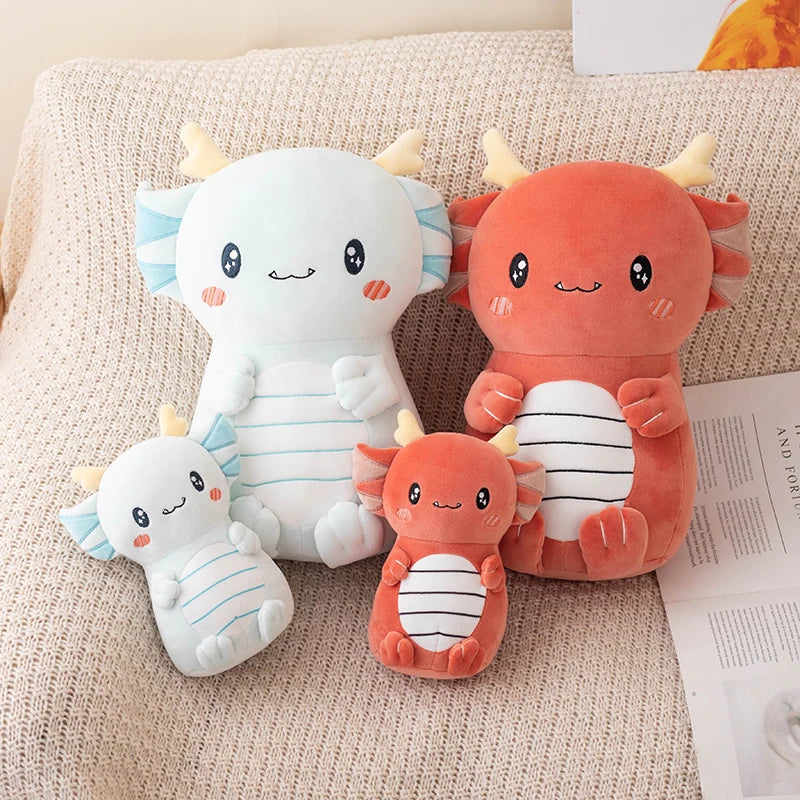 Set of four cute kawaii plush toys resembling axolotls on a textured surface.