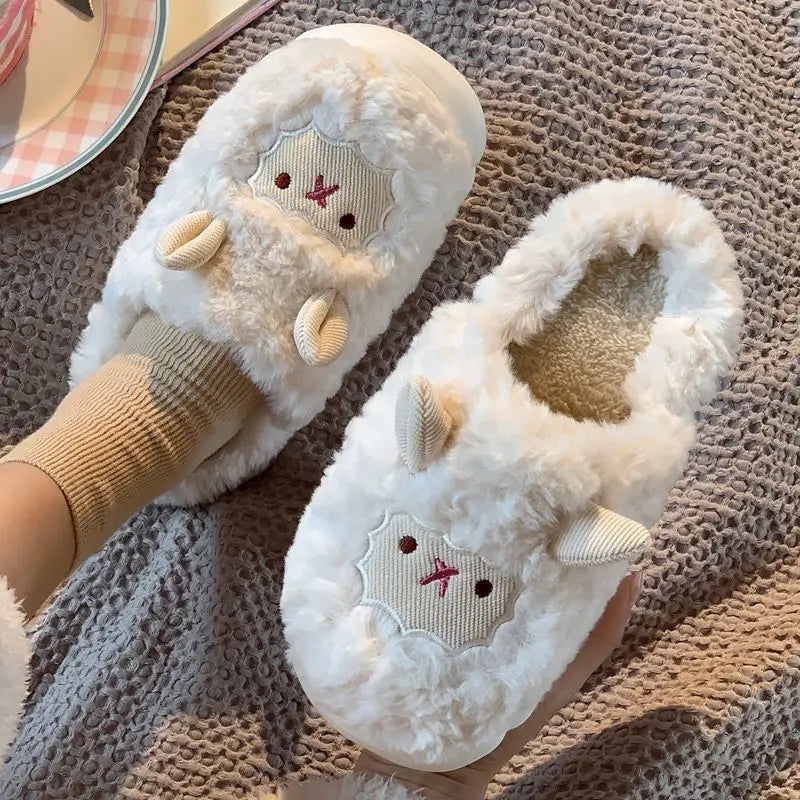 Pair of white slippers with kawaii cartoon face design on a textured surface