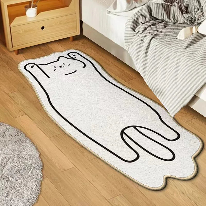 Kawaii cat-shaped rug on a wooden floor next to a bed