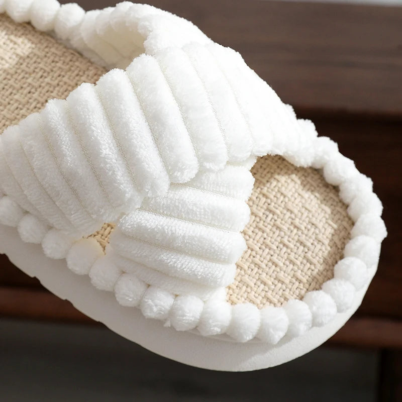 Close-up of a white kawaii slipper with textured sole on a blurred background