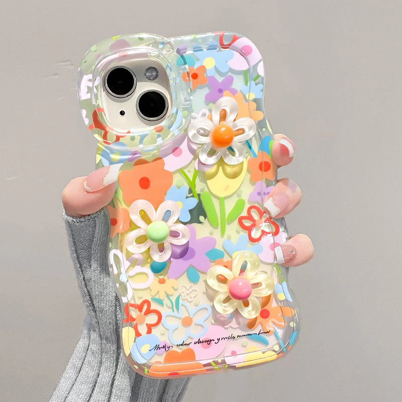 Colorful kawaii floral phone case held by a person against a neutral background