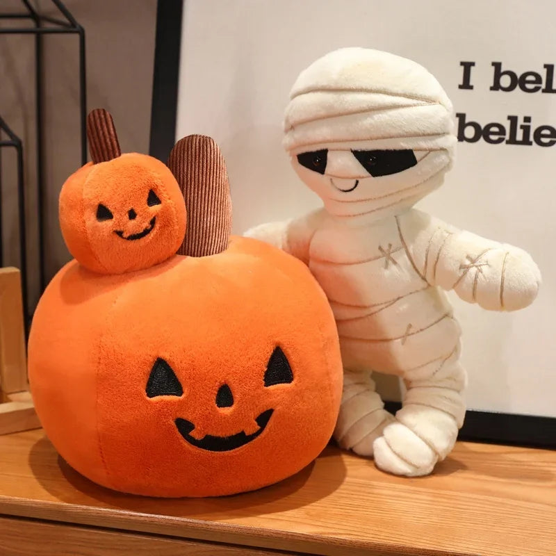 Kawaii plush pumpkin and mummy toy on a wooden surface with a blurred background.