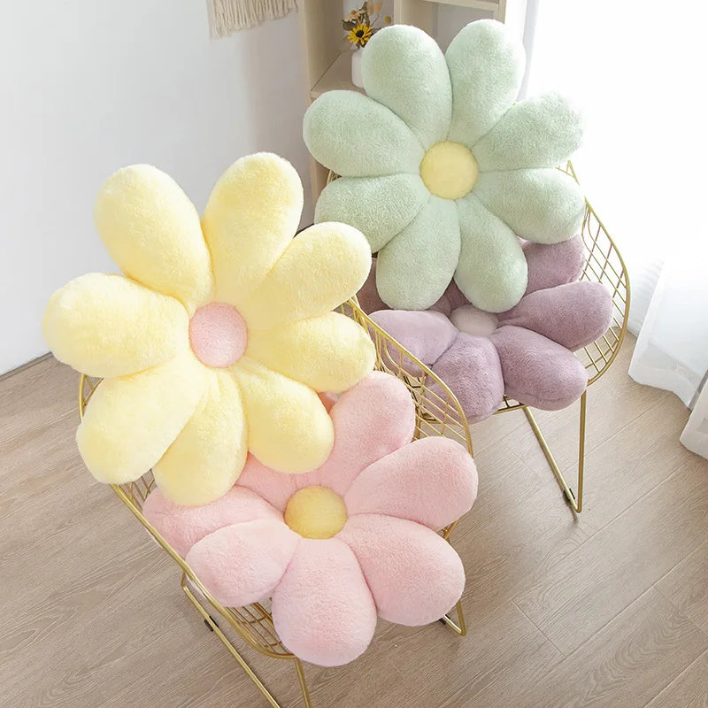 Three colorful Kawaii flower-shaped cushions on a gold chair in a room.