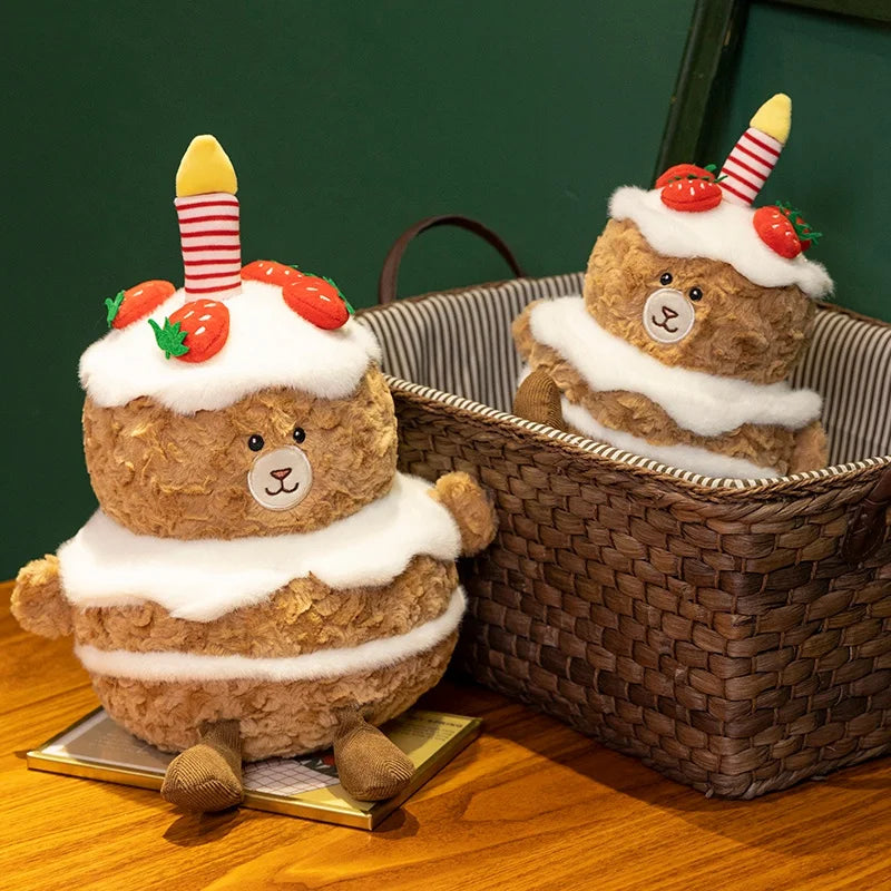 Two teddy bears decorated like birthday kawaii cakes in a wicker basket on a wooden surface.
