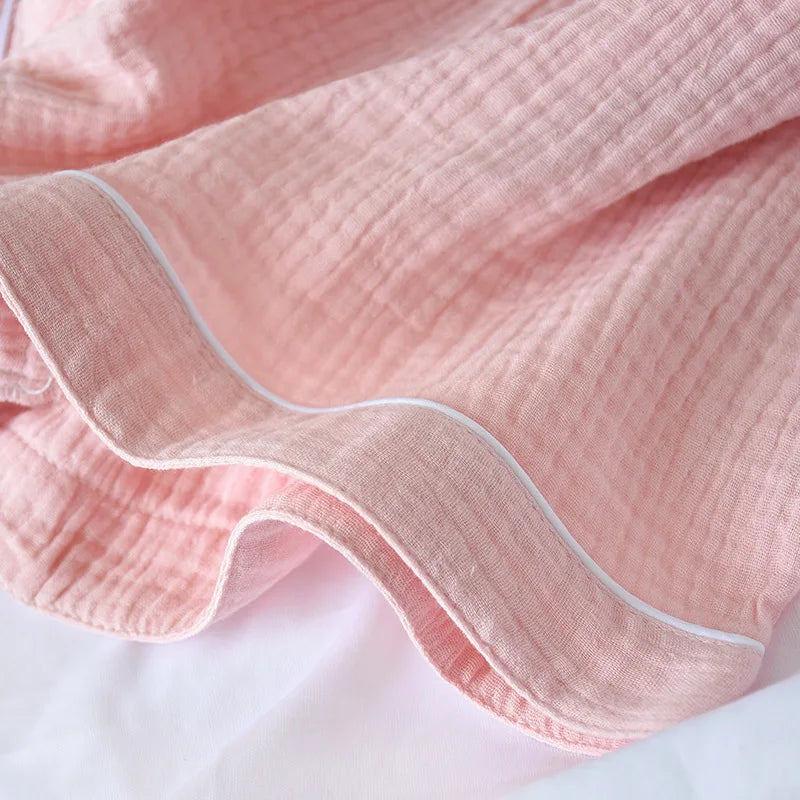 Close-up of pink kawaii fabric with a ruffled edge on a white background