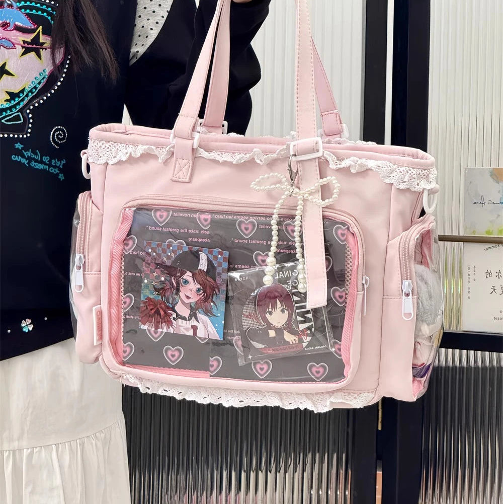Person holding a pink Kawaii bag with anime-themed design