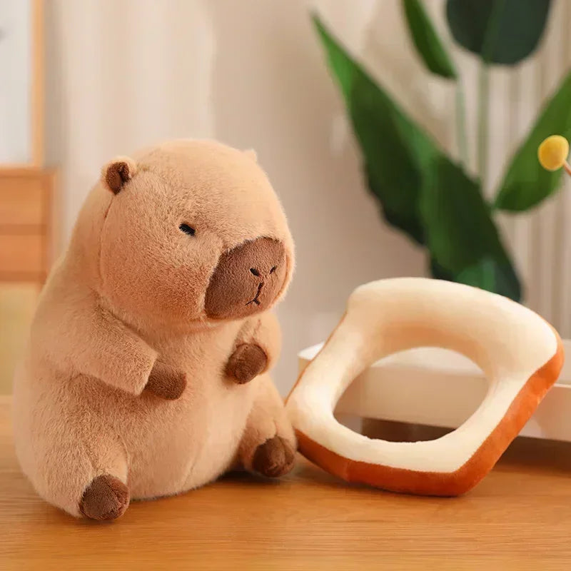 Plush kawaii toy beaver next to a ceramic dish on a wooden surface with a plant in the background