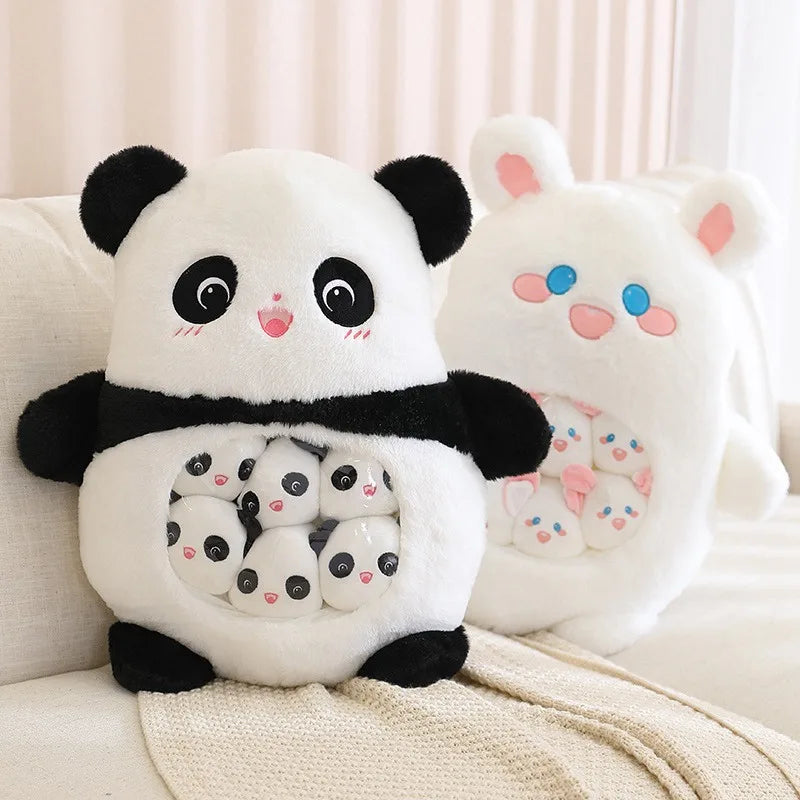 Kawaii plush toy panda holding smaller plush pandas on a beige couch.