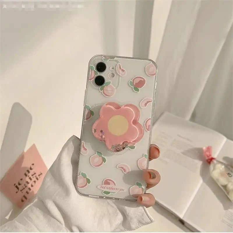Phone case with kawaii floral design held by a hand on a light background