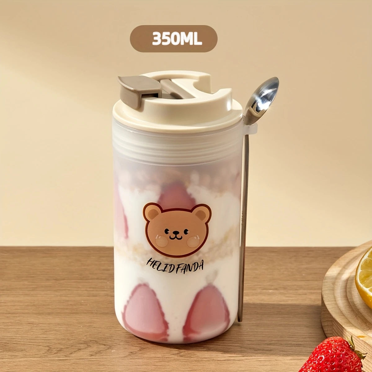 Tumbler with Kawaii bear design and strawberry pattern on a wooden surface