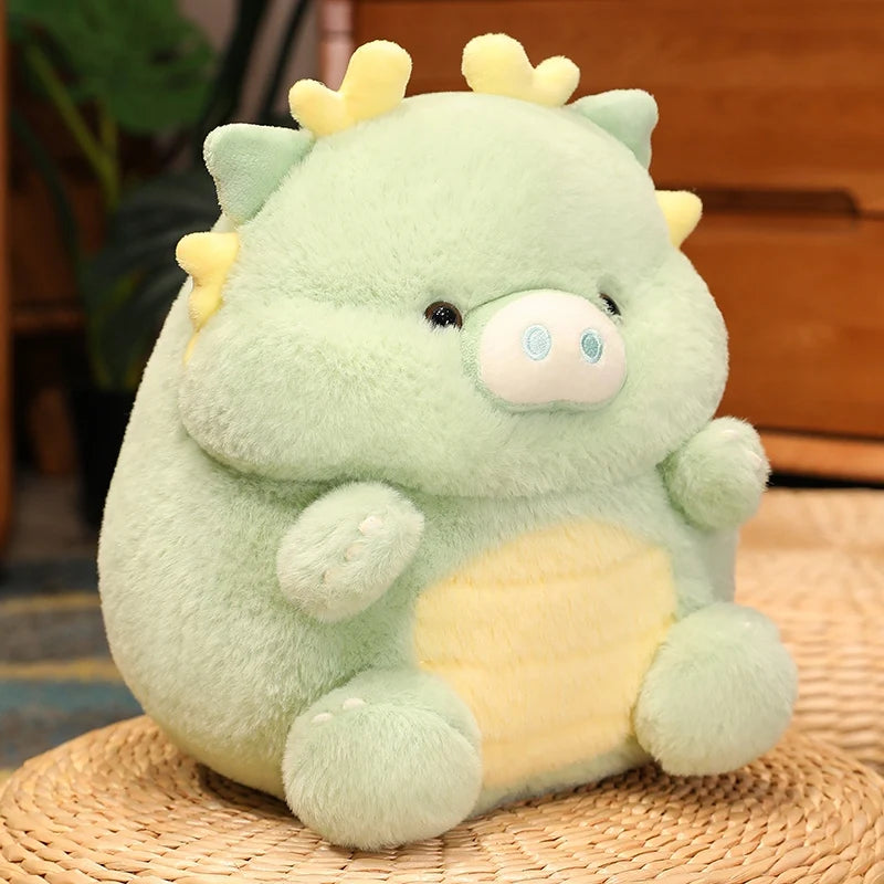 Kawaii plush toy dragon with green body and yellow accents on a woven mat