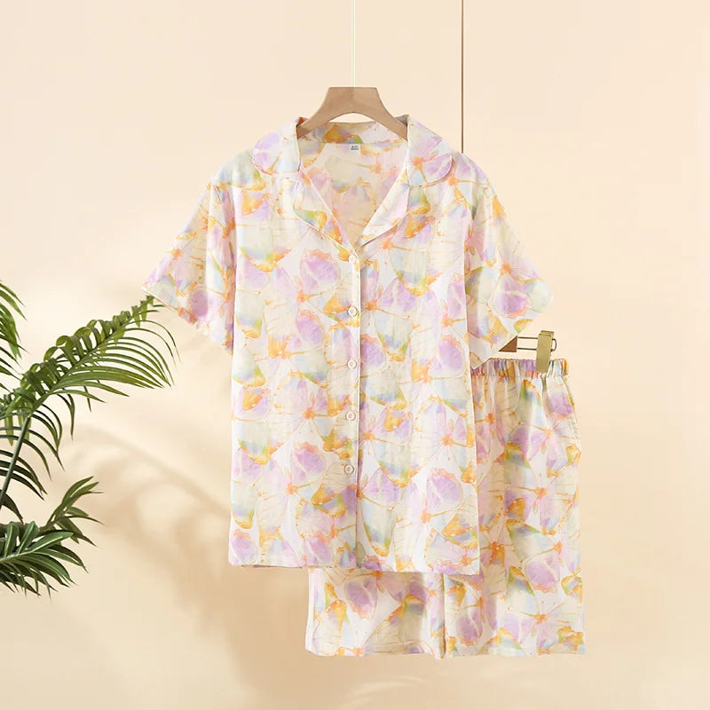 Floral kawaii pajama set on a hanger against a beige background