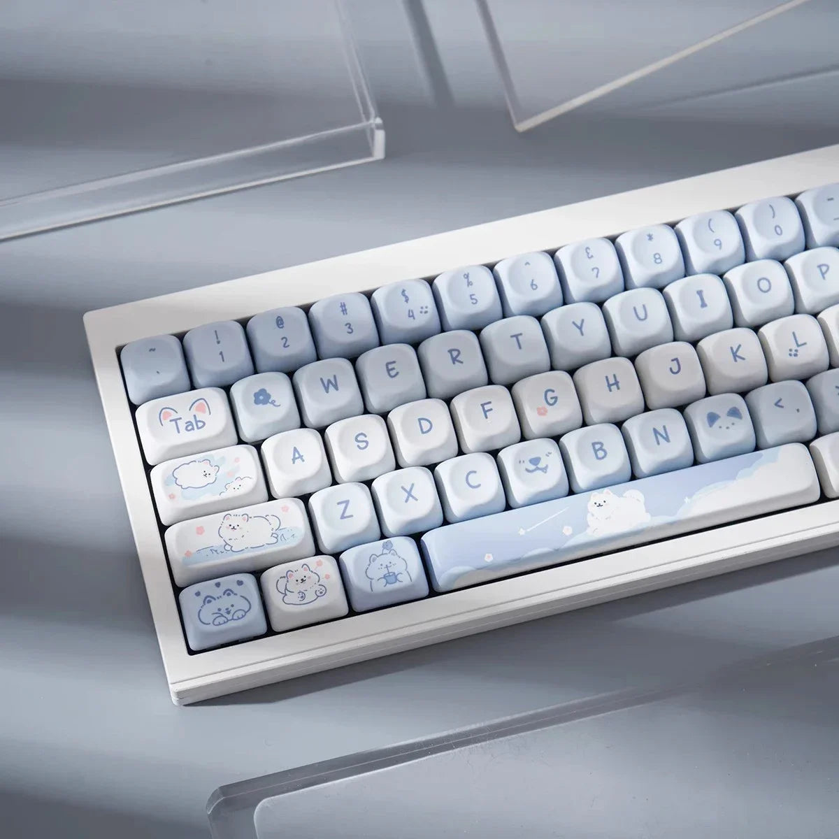 Keyboard with Kawaii cute character designs on keys against a neutral background
