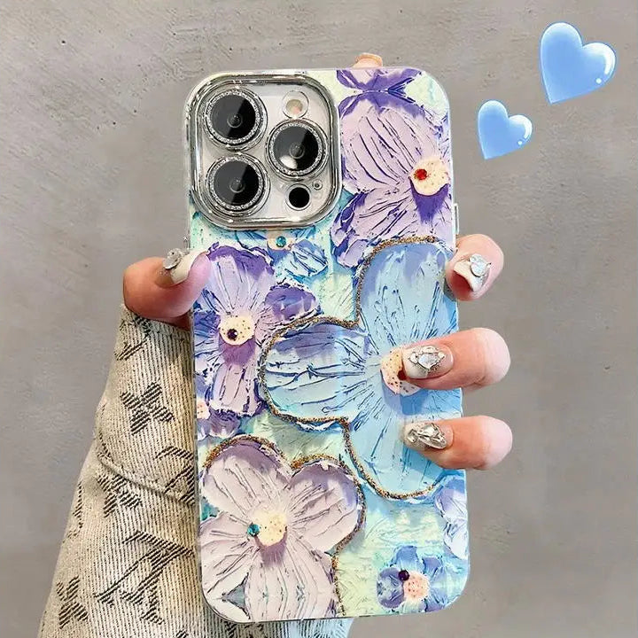Phone case with kawaii floral design held by a hand on a metallic surface