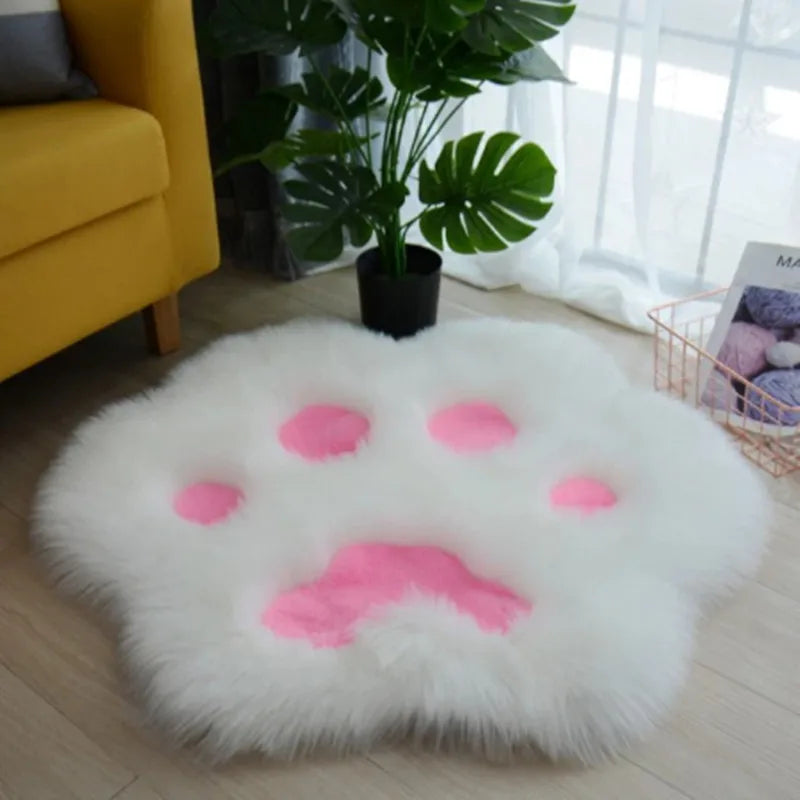 Round white kawaii rug with pink accents in a room with a yellow chair and plant.