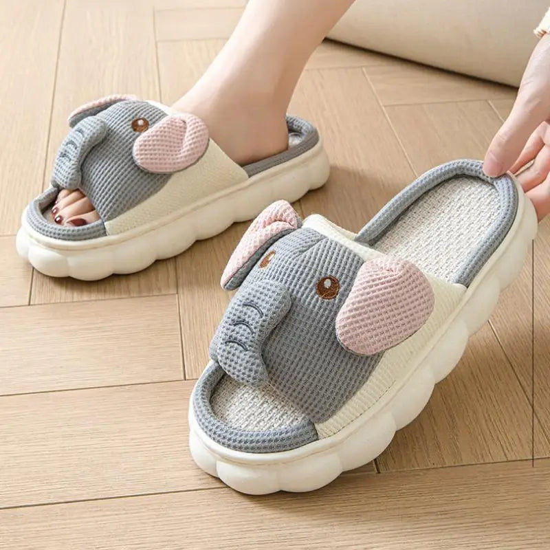 Gray slippers with kawaii pink ears worn on a wooden floor