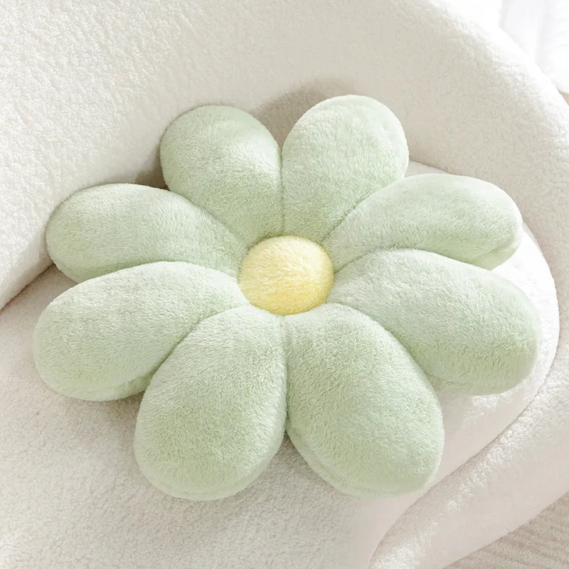 Flower-shaped Kawaii pillow with light green petals and a yellow center on a white background