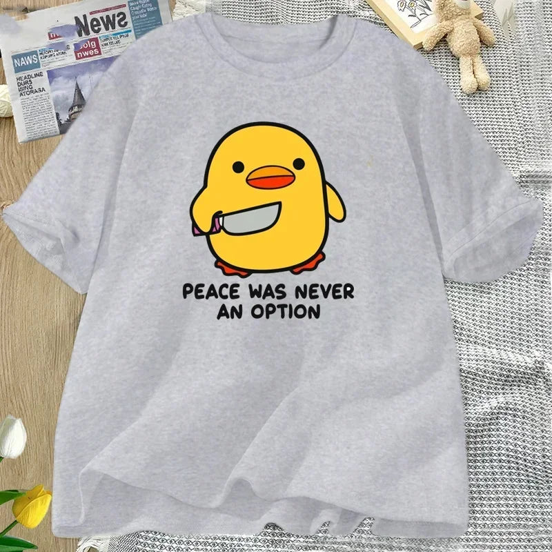 Gray t-shirt with a yellow kawaii duck graphic and 'Peace was never an option' text on a textured surface.