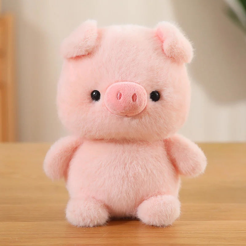 Pink plush kawaii toy pig on a wooden surface with a blurred background