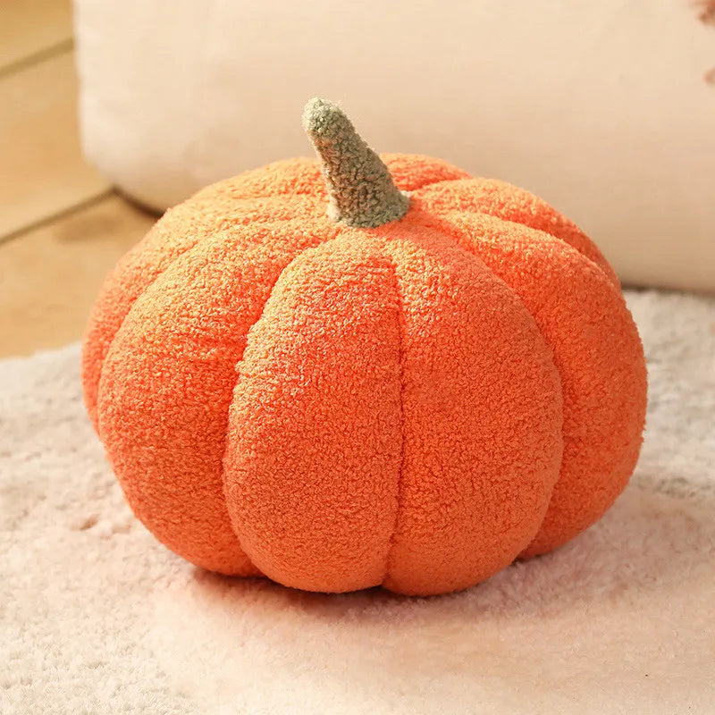 Fuzzy orange kawaii pumpkin on a soft surface