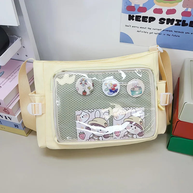 Beige pouch with Kawaii cartoon designs on a desk