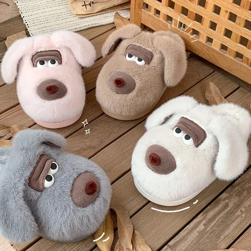 Four dog-shaped kawaii slippers in pink, brown, gray, and white on a wooden floor.