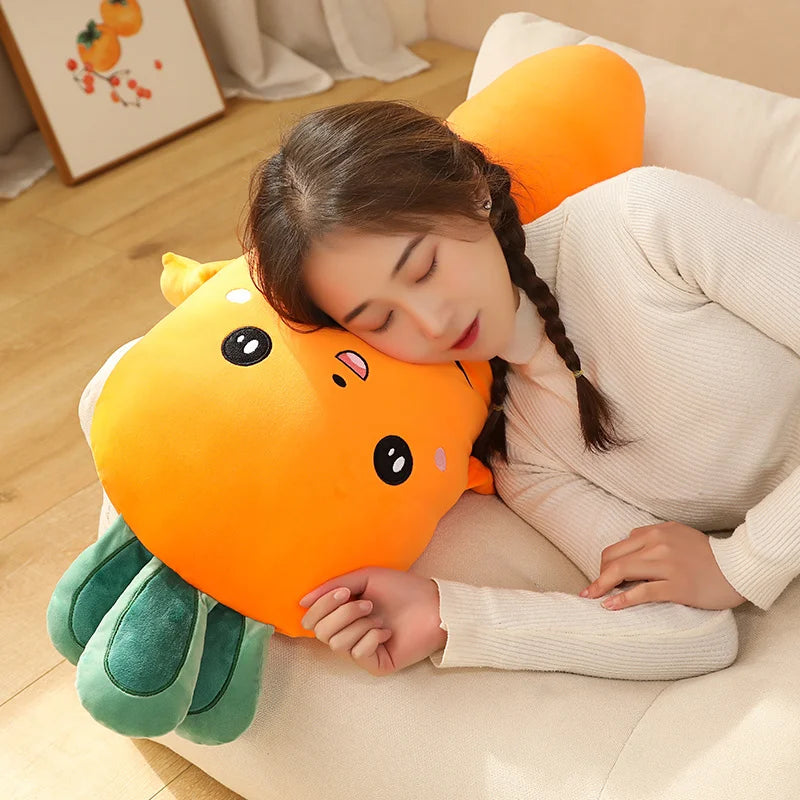 Woman lying on a couch with a large, plush, kawaii cartoonish orange creature pillow.