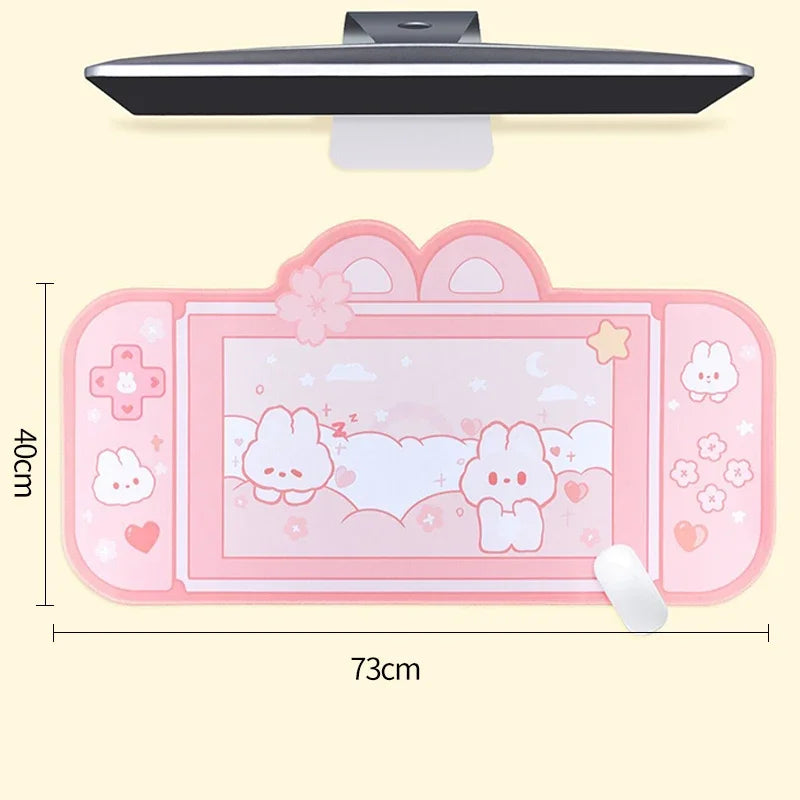 Pink Kawaii cartoon-themed desk mat with dimensions on a beige background