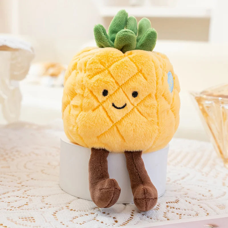Plush kawaii toy pineapple with a smiling face on a white surface