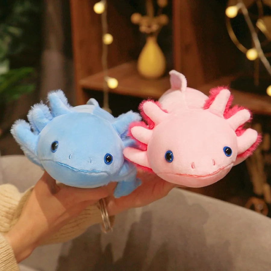 Two kawaii axolotl plush toys