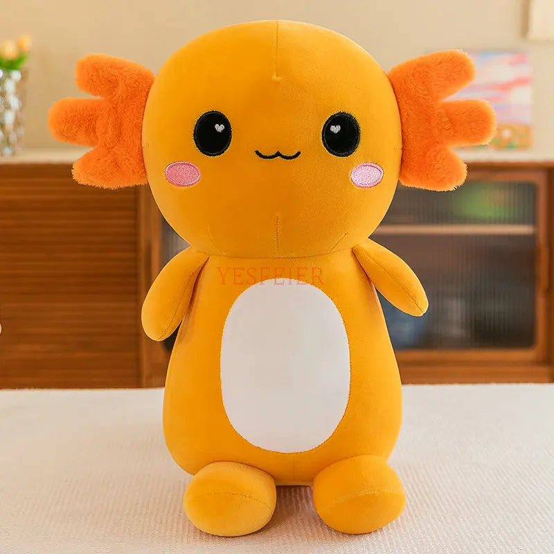 Orange kawaii plush toy with black eyes and pink cheeks on a light surface.
