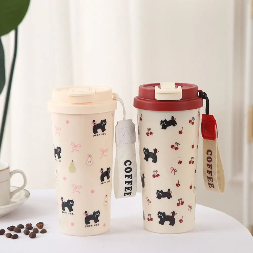 Two ceramic travel mugs with Kawaii dog patterns on a white surface.