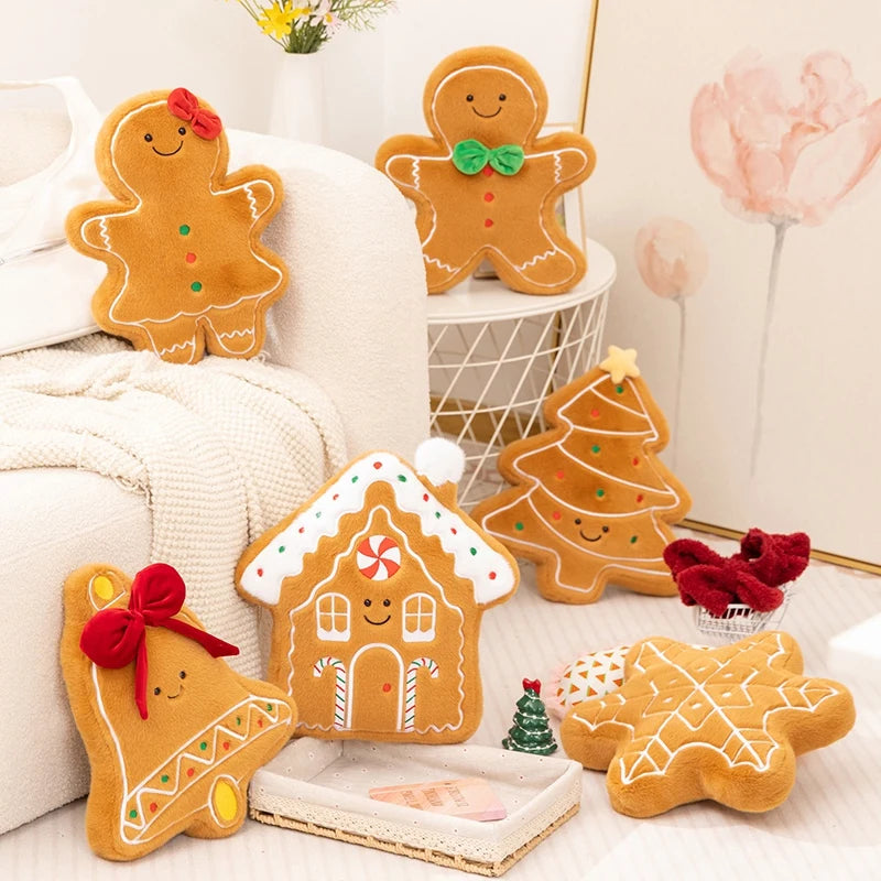 Decorative gingerbread-themed kawaii pillows on a white surface with a soft, neutral background.