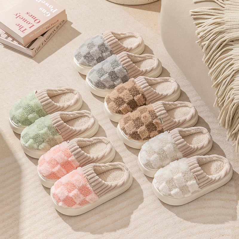 Set of kawaii colorful slippers arranged on a soft surface with books in the background.