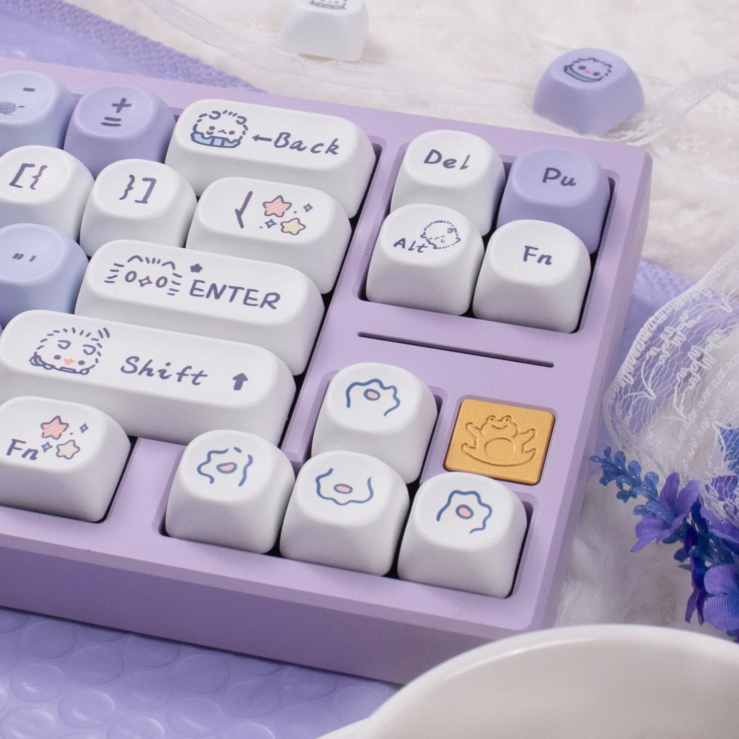 Kawaii keyboard with white keys and purple frame on a soft surface