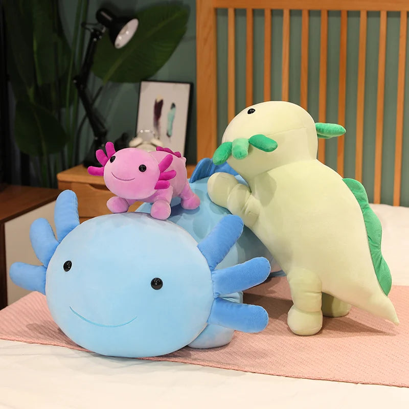 Three colorful plush kawaii toys on a bed with a wooden headboard and plant in the background.