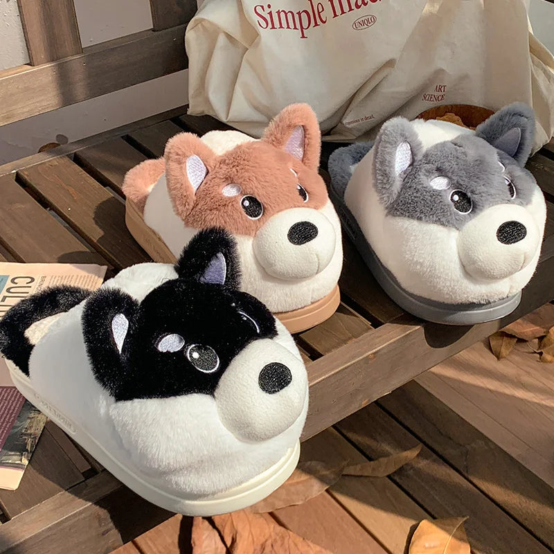 Three kawaii cartoon-style slippers shaped like animals on a wooden surface.