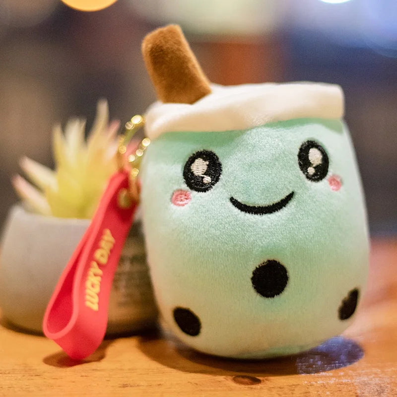 Kawaii plush toy resembling a marshmallow with a smiley face on a wooden surface