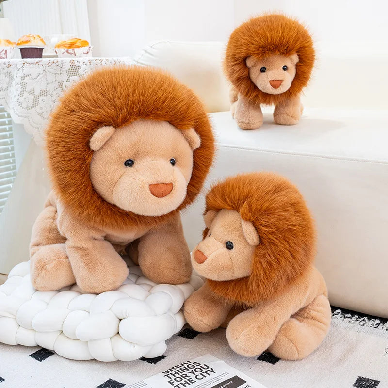 Three kawaii plush lion toys on a white surface with a light background