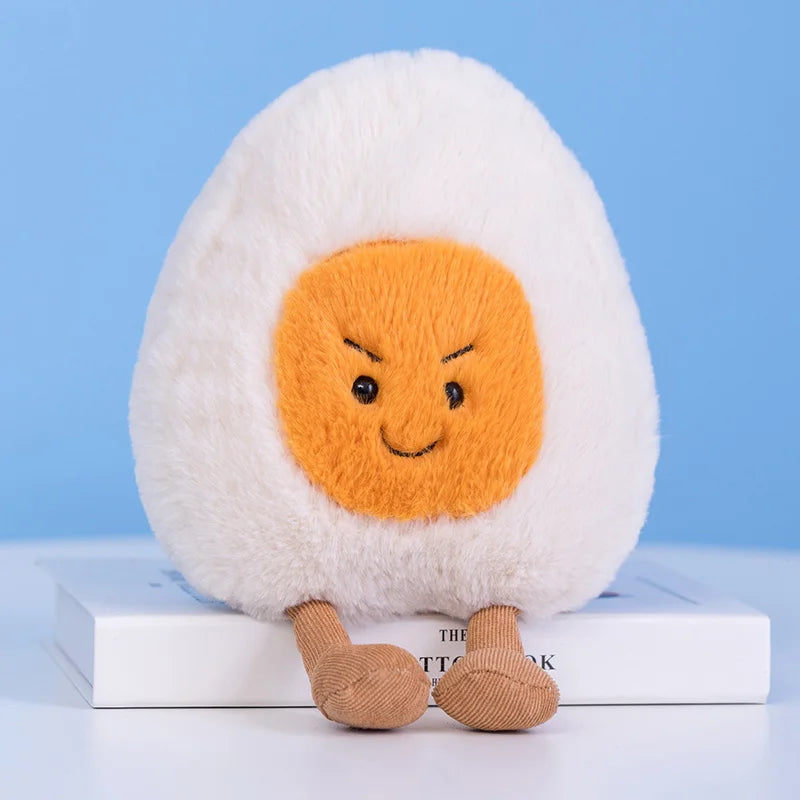 Plush kawaii toy resembling a boiled egg with a smiling face on a blue background