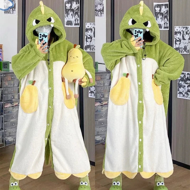 Person wearing a green and white kawaii dragon onesie in a room with posters on the wall.
