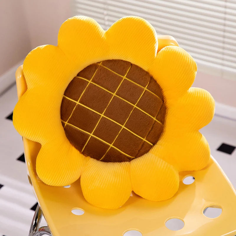 Yellow sunflower-shaped kawaii cushion on a chair with a blurred background