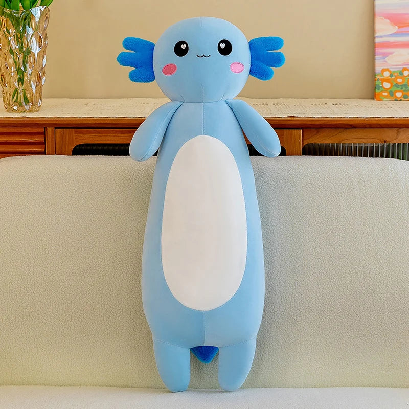 Blue kawaii plush toy with a white belly on a beige couch